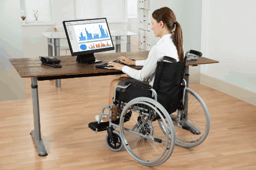business woman in a wheelchair using the computer