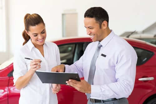 Woman buying a used car